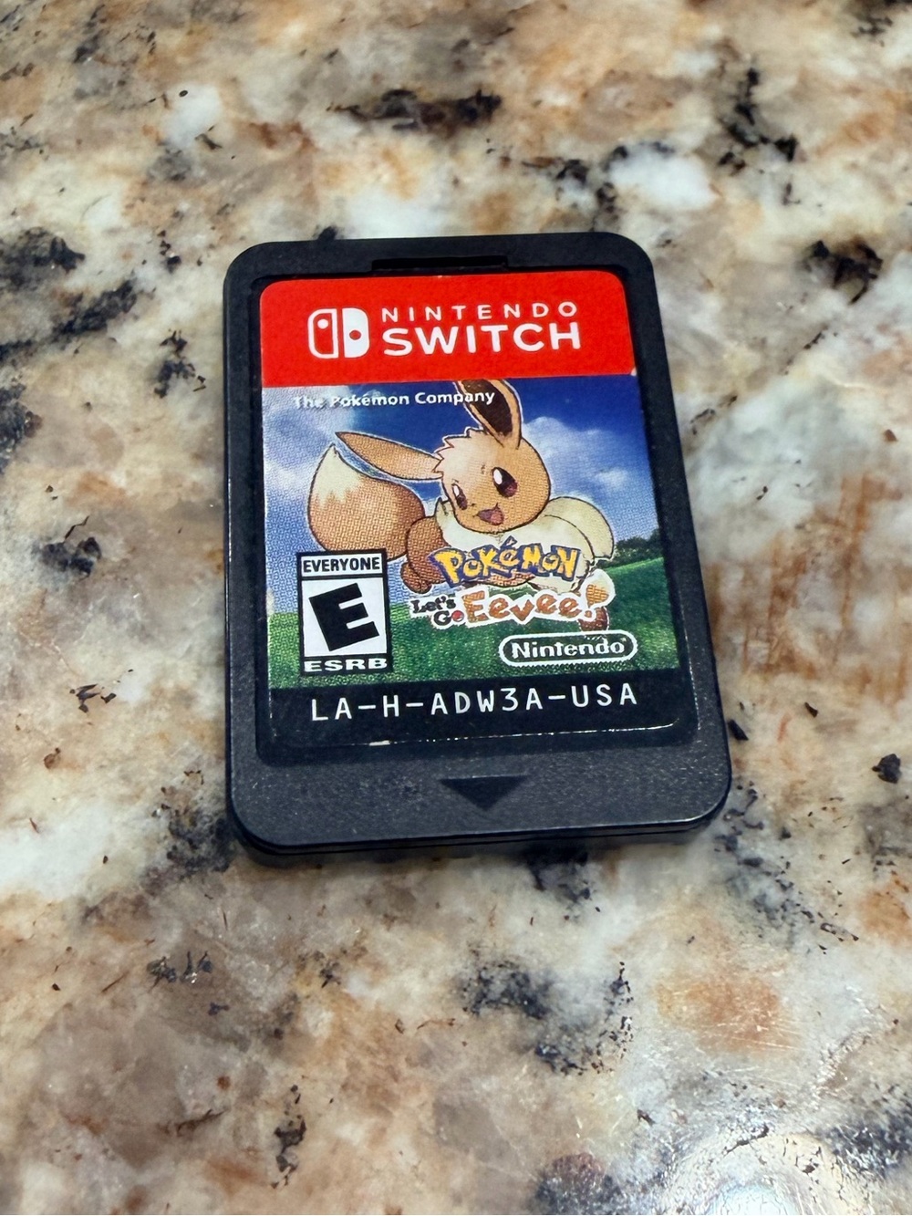Nintendo Switch Game Card with Red, Black, Blue, Green, Brown Label